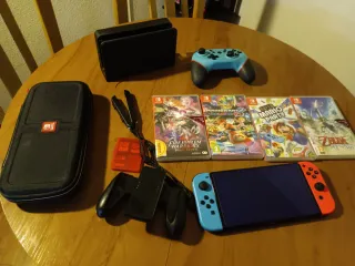 Nintendo Switch OLED + 2 Mandos + 2 Juegos