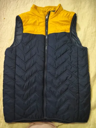 Chaleco acolchado azul y amarillo. Talla 12