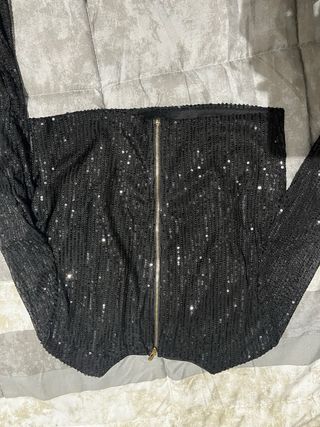 Conjunto lentejuelas negro con plumas