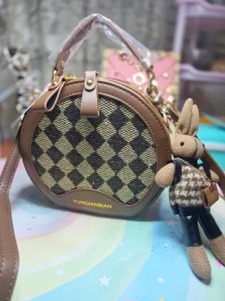 Bolso redondo con estampado de cuadros