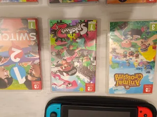Nintendo Switch Azul y Naranja + Caja + 6 juegos