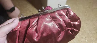 Bolso de fiesta rosa y dorado con lazo