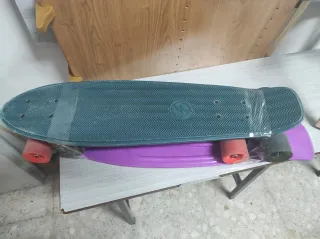 Monopatín rosa y negro Oxelo