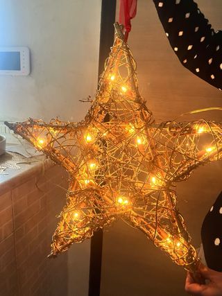 Stella decorativa luminosa dorata