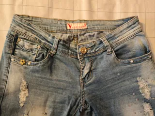 Jeans donna strappati con strass