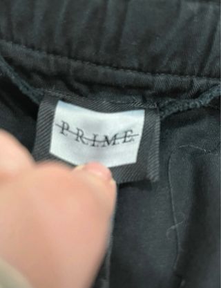Pantaloni Prime neri con inserti verdi