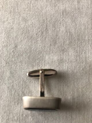 Gemelos de plata con piedra verde