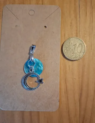 *Colgantes Diseños* (concha de mar colores)