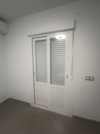 Ventanal corredero con persiana