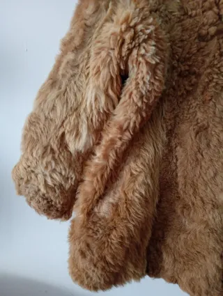 Casaco de pêlo castanho e bege. O problema/ forro