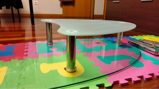 Mesa centro cristal y acero ovalada