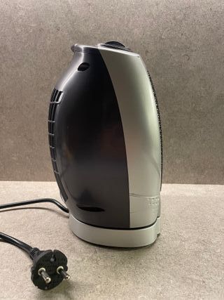 Calefactor eléctrico Marca "OK".