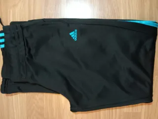 Pantalón Adidas negro y turquesa