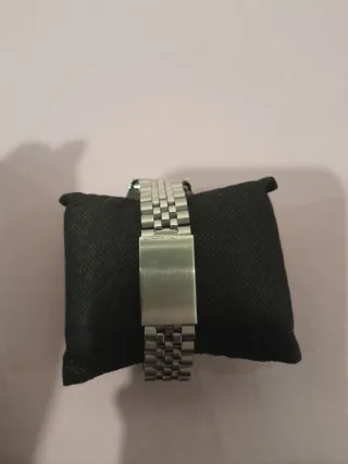 Reloj de pulsera turquesa y plateado