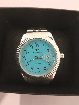 Reloj de pulsera turquesa y plateado
