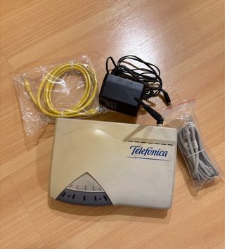 Router Telefonica con cables y adaptador