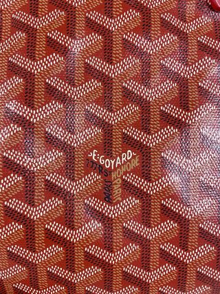 Bolso Goyard con monedero marrón y rojo