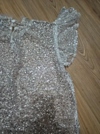 Top lentejuelas plateadas volantes