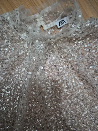 Top lentejuelas plateadas volantes