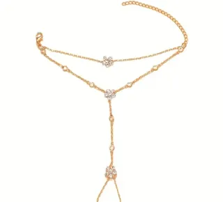 Pulsera de dedo con flores doradas