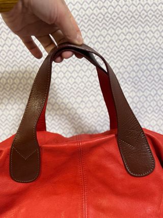 Borsa in pelle rossa con manici marroni