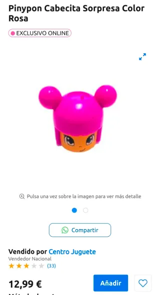 Juguete infantil morado con cara sonriente