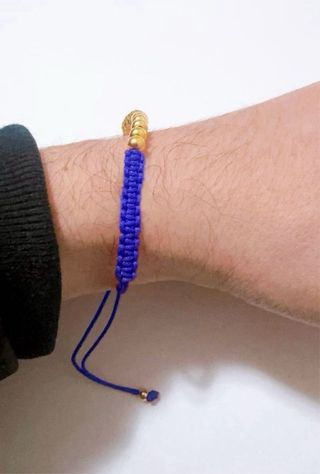 Bracciale in stoffa con sfere in oro giallo 18kt