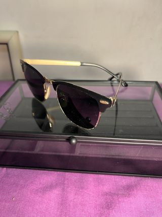 Gafas de sol Ray-Ban Clubmaster negras y doradas