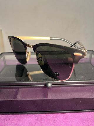 Gafas de sol Ray-Ban Clubmaster negras y doradas