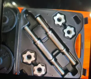 Banco de pesas con barra y discos