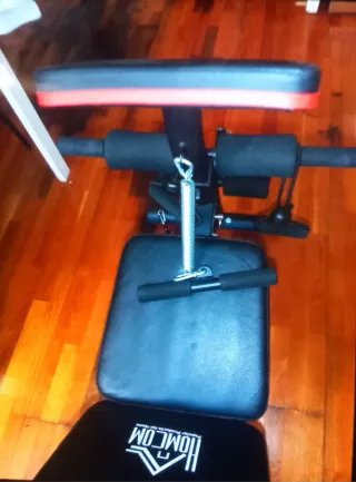 Banco de pesas con barra y discos