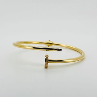 PULSERA RIGIDA CLAVO CON CIRCONITAS. Oro 18k. Peso