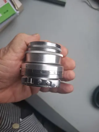 Voigtländer Dynaron 100 mm. + parasol especifico