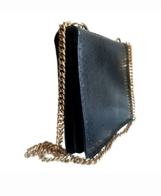 Bolso piel serpiente cadena dorada