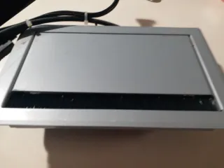 Protector de enchufes gris