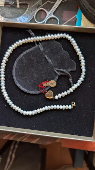 Coyar perla blanca y oro 18 kilates esté coya es a