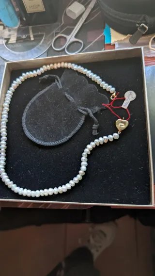 Coyar perla blanca y oro 18 kilates esté coya es a