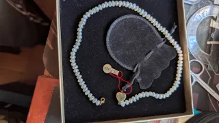 Coyar perla blanca y oro 18 kilates esté coya es a