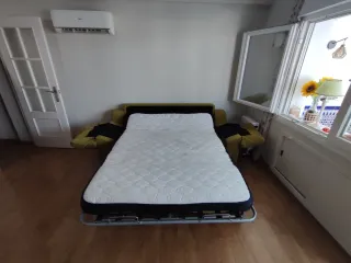 Sofá-cama verde tela