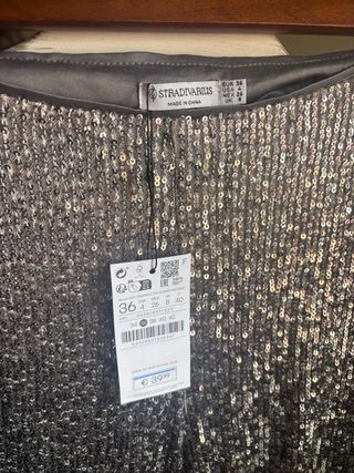 Pantalón flare lentejuelas gris y plata