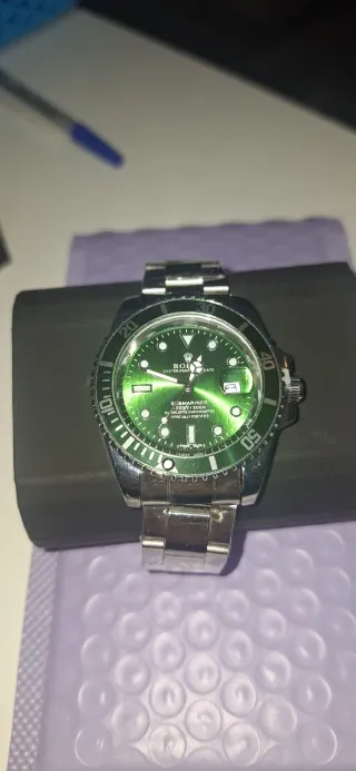 Orologio di lusso verde e argento