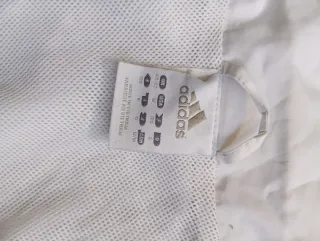 Chaqueta Adidas blanca con rayas azules