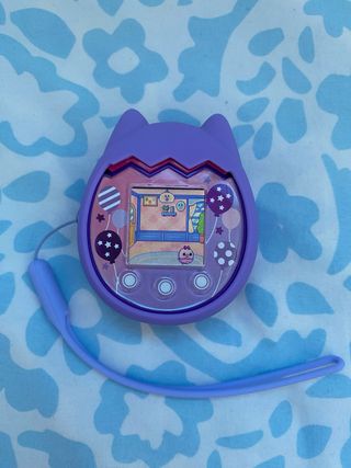 Tamagotchi Pix Party Morado + Funda y correa