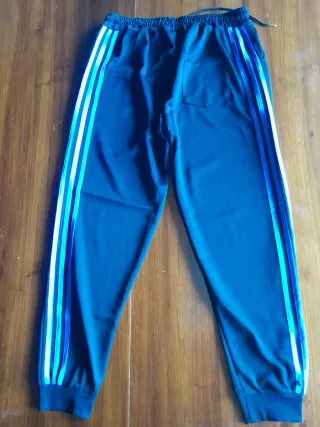 Pantaloni tuta neri con strisce azzurre