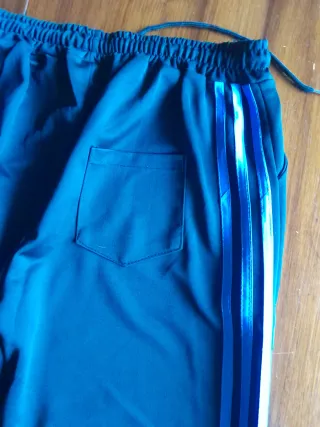 Pantaloni tuta neri con strisce azzurre