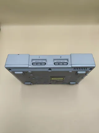 Console PlayStation 1 con accessori