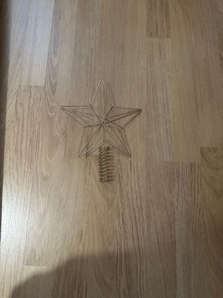 Adorno estrella navideña metal dorado