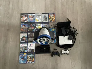 Consolle PlayStation 2 con giochi e accessori
