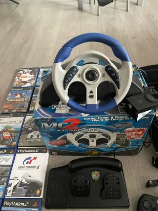 Consolle PlayStation 2 con giochi e accessori