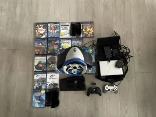 Consolle PlayStation 2 con giochi e accessori